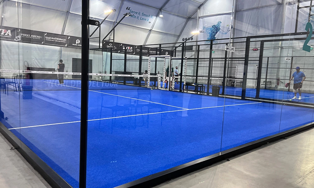 What are padel court walls made of?